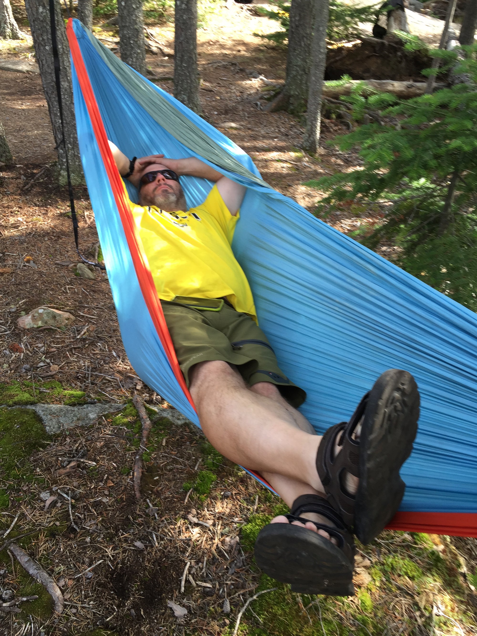 Man in camping hammock in Boundary Water Canoe Area, Minnesota 